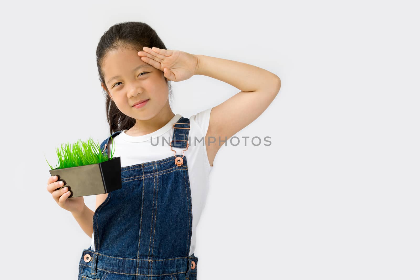 Studio shot of organic farming concept, Asian child farmer, isolated on white background.