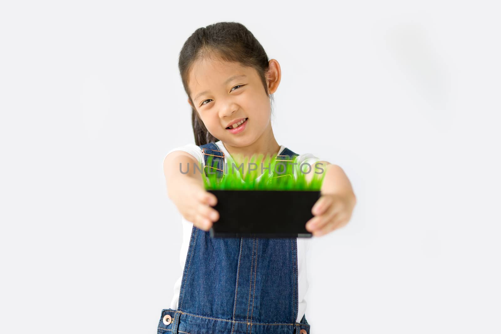 Studio shot of organic farming concept, Asian child farmer, isolated on white background.