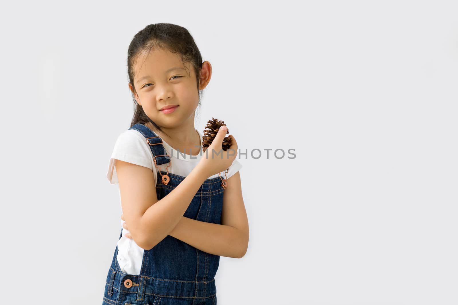 Studio shot of organic farming concept, Asian kid farmer, isolated on white background.