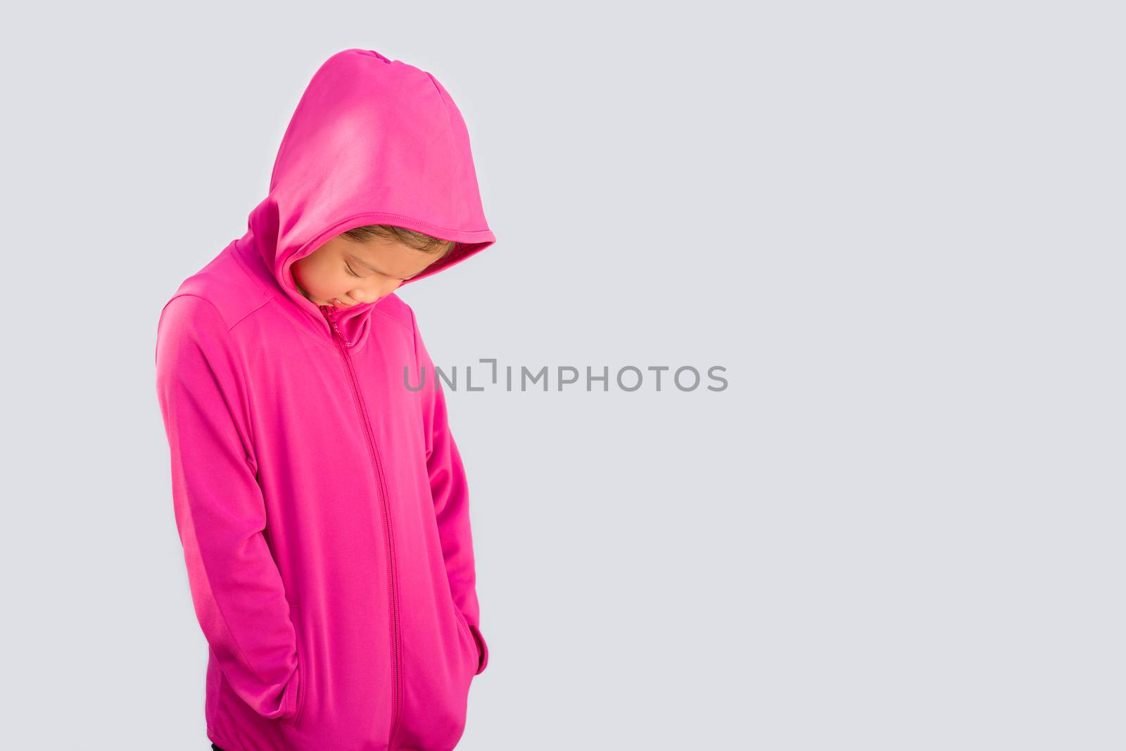 Studio Shot of Asian kid in sweater isolated on white background.
