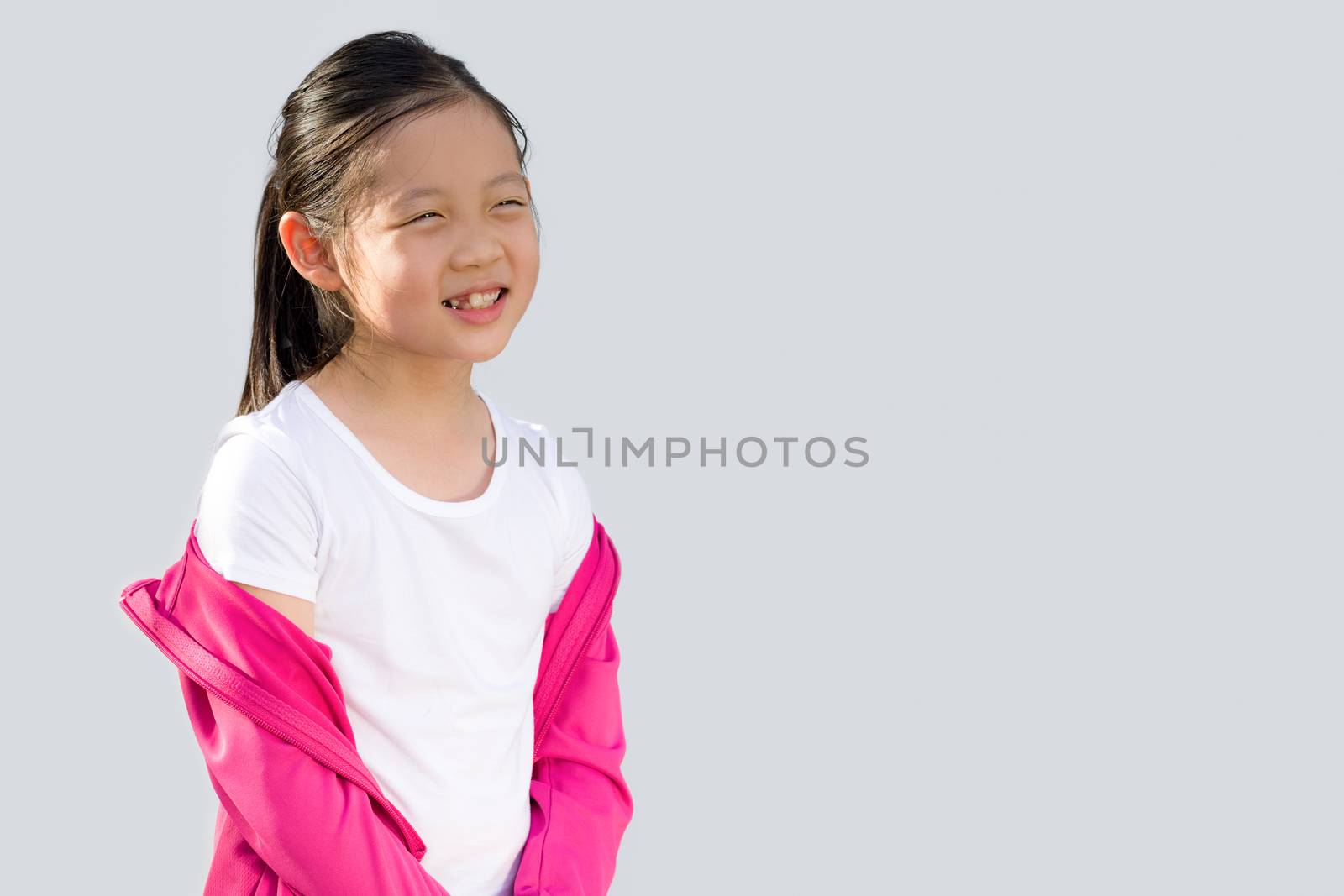 Studio Shot of Asian child in sweater isolated on white background.