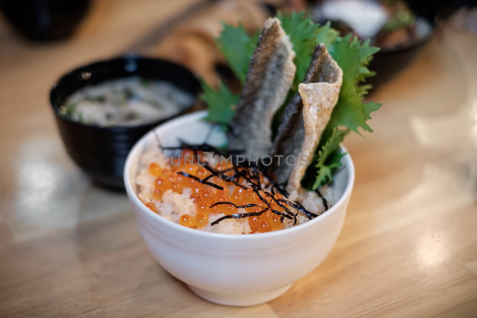 Japanese rice bowl with salmon eggs, caviar topping.