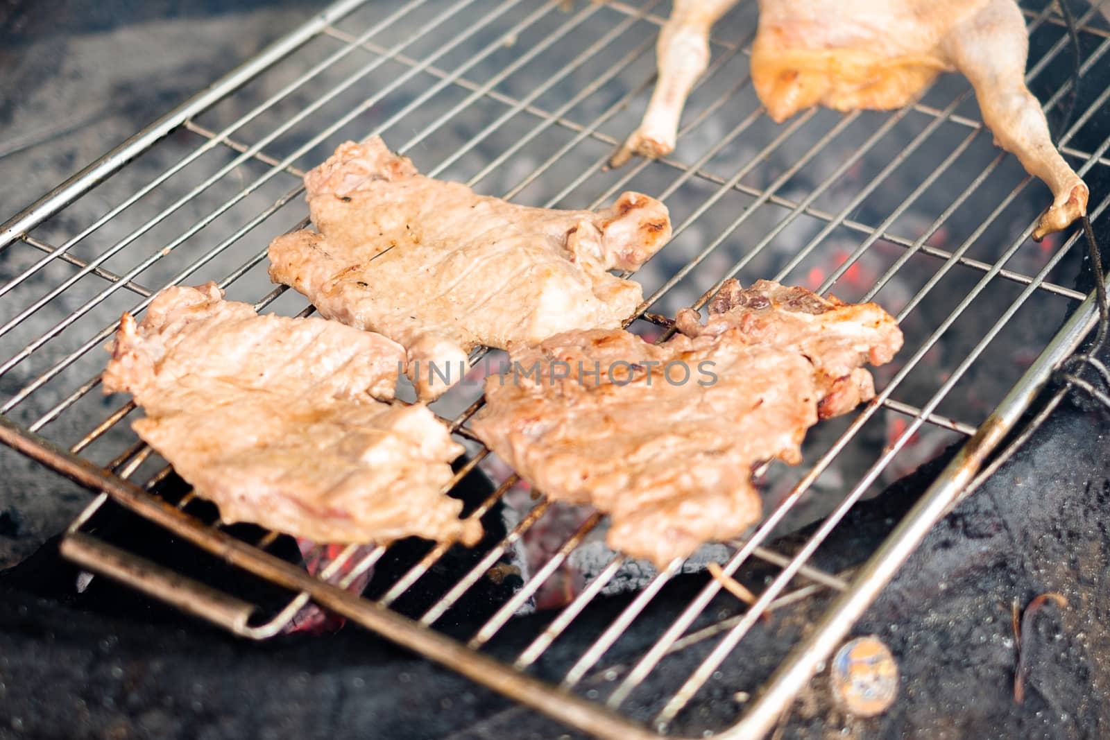 Grilled pork with smoke, street food style.
