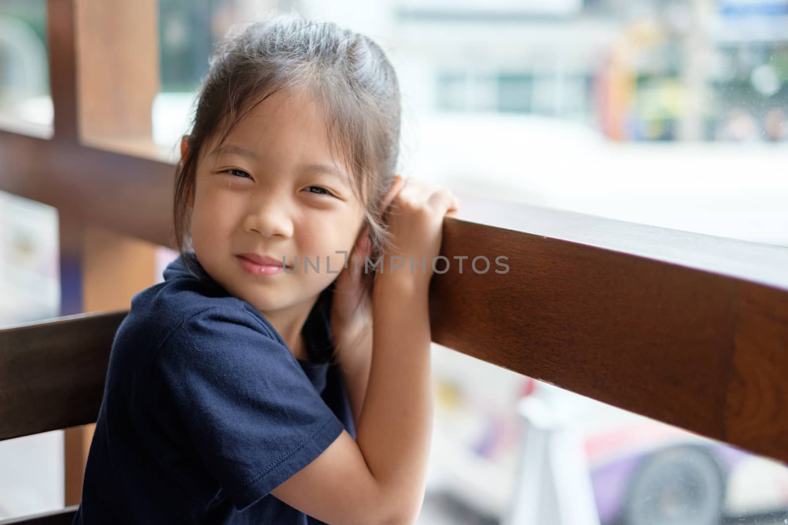 Smiling Asian child or kid in happy and joyful expression.