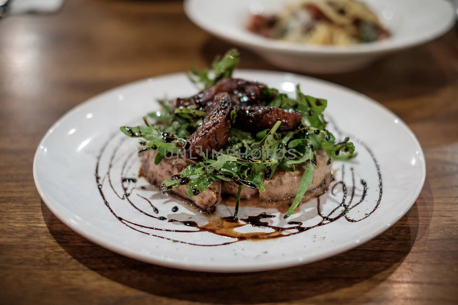 Grilled port chop steak with apple sauce.