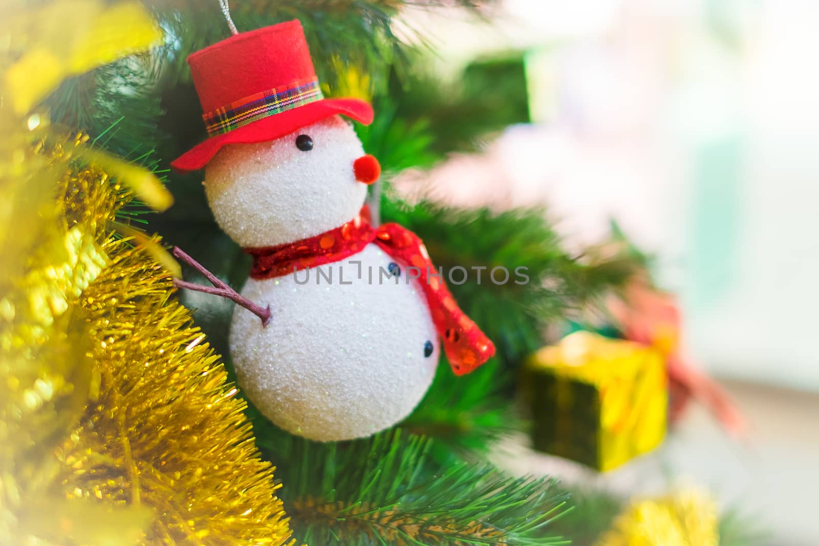 Snowman on a Christmas tree as decoration.