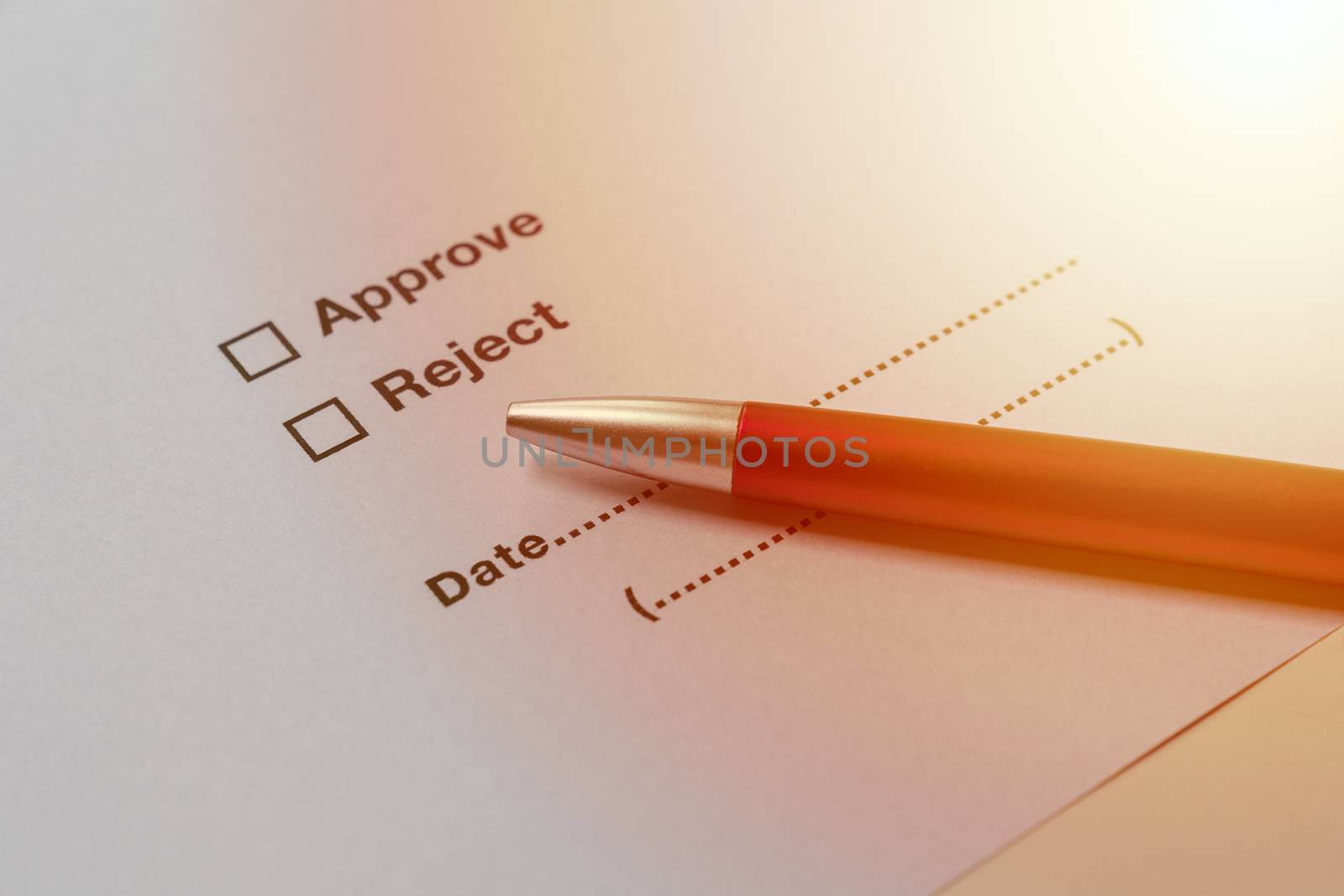 Business concept illustrated by approve and reject choices on document with pen.