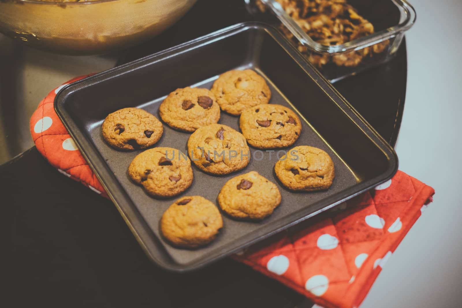 Vintage look of freshly baked cookie on baking tray.