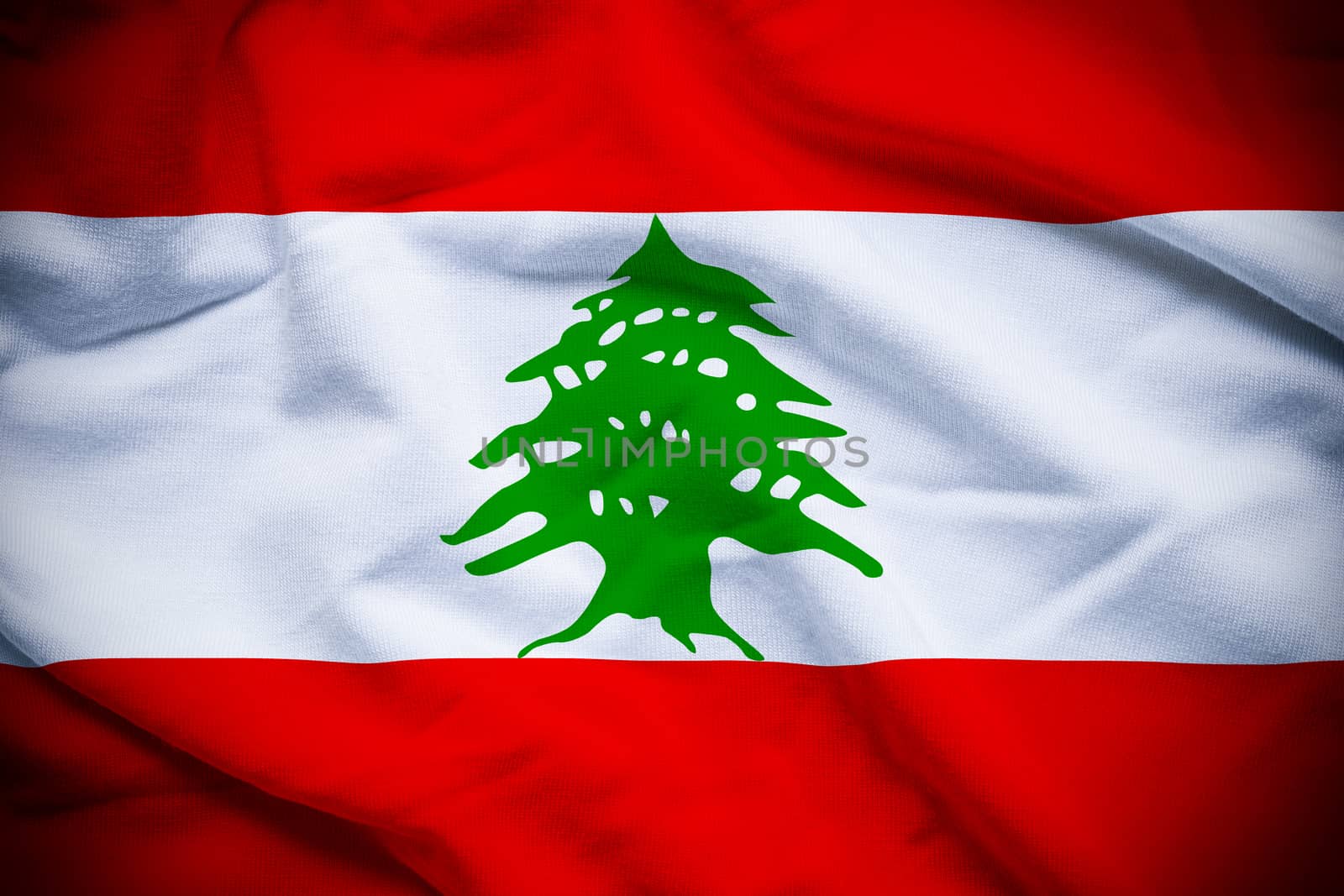 Wavy and rippled national flag of Lebanon background.