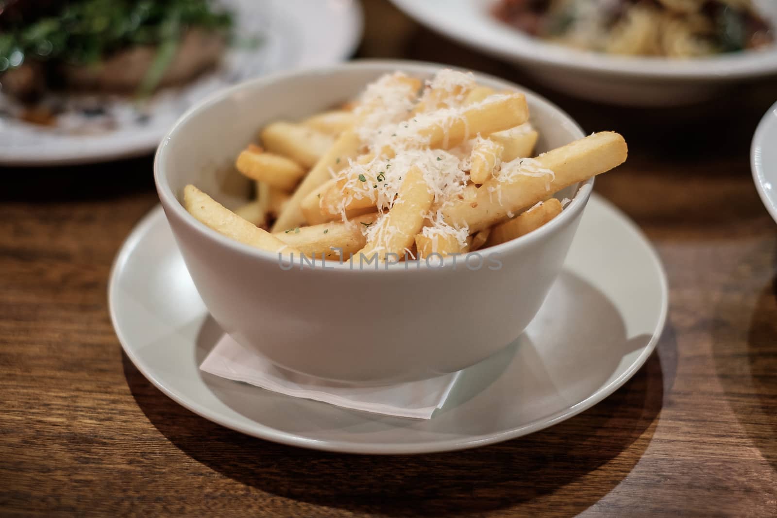 French fries with cheese on top.