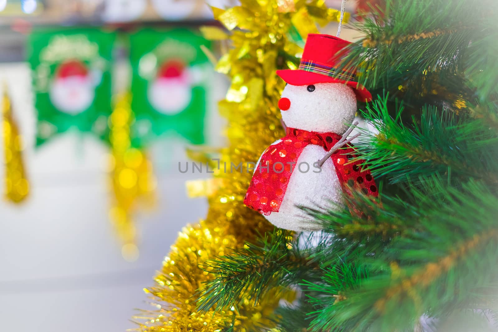 Snowman on a Christmas tree as decoration.