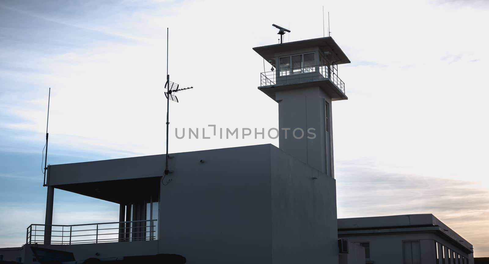 Sete, France - January 4, 2019: control tower of the port near the marina on a winter day
