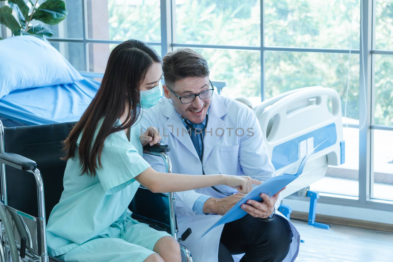 The doctors are checking the patients' symptoms closely. Asian female patients wear masks to prevent and stop the spread of the virus.