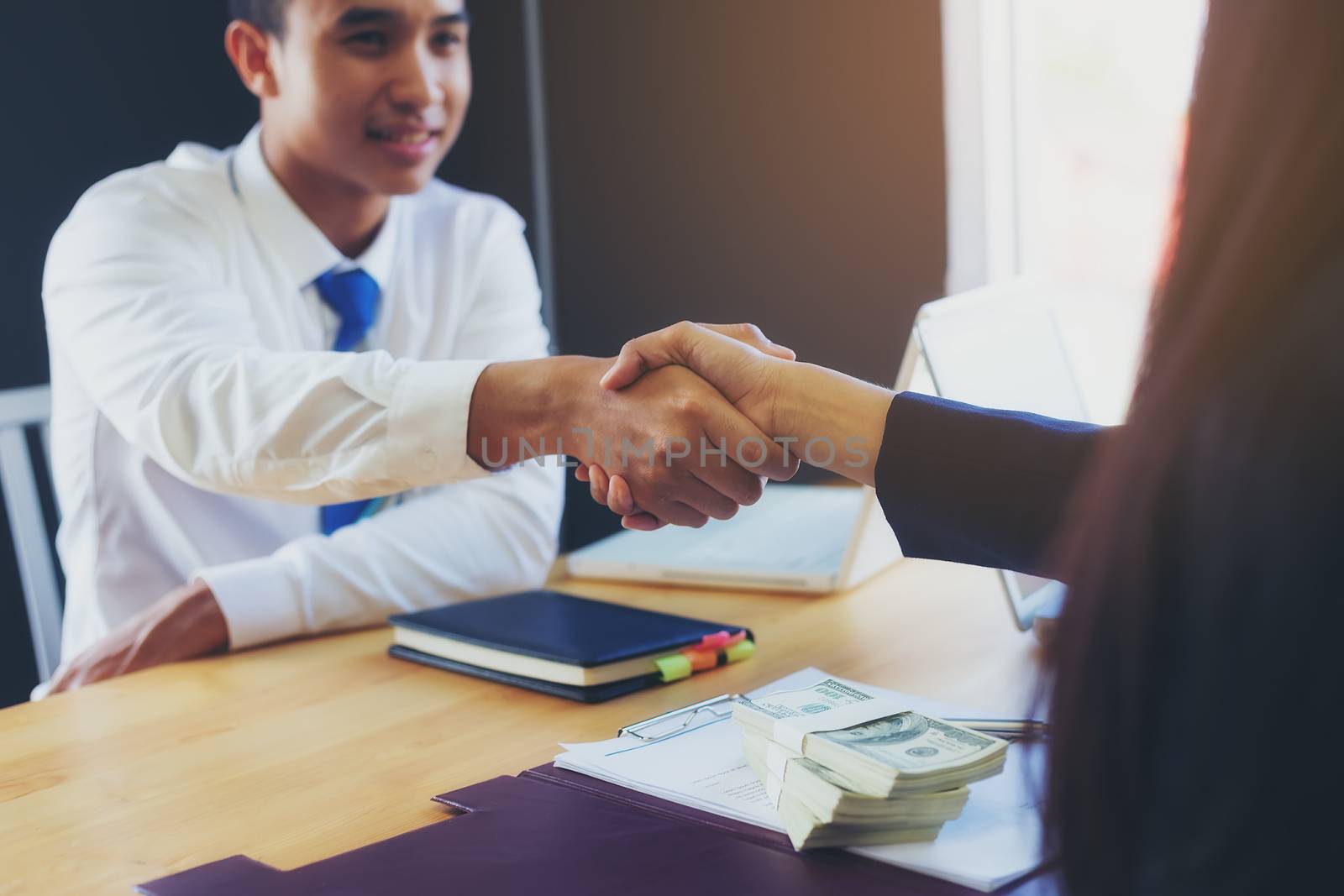 Business woman signing a loan for investment, negotiation