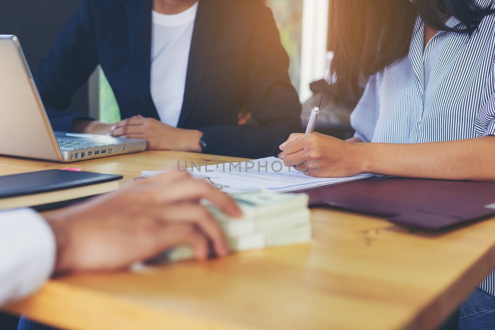 Business woman signing a loan for investment, negotiation