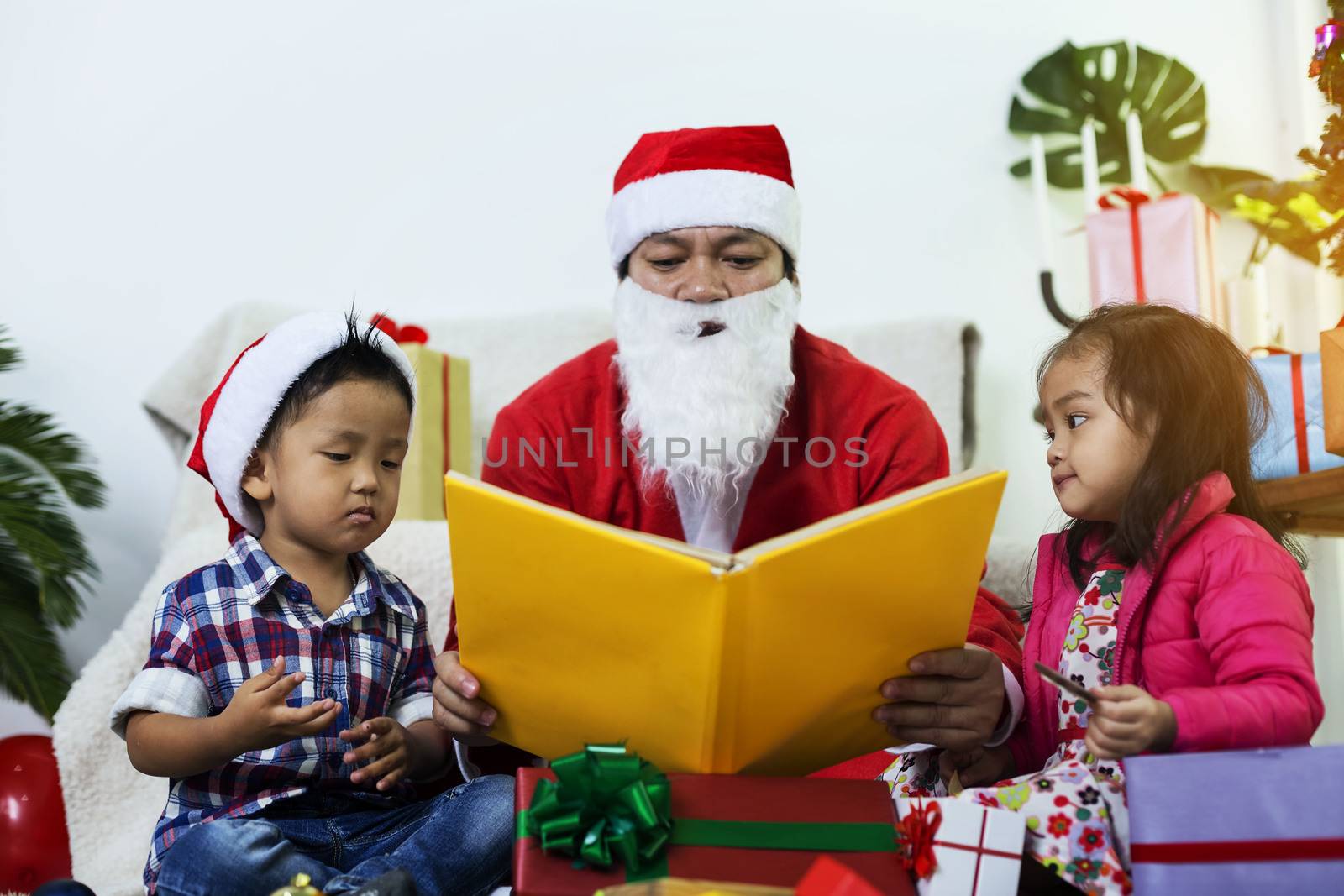 Santa Claus gives gifts and reads fairy tales to boys and girls  by numberone9018