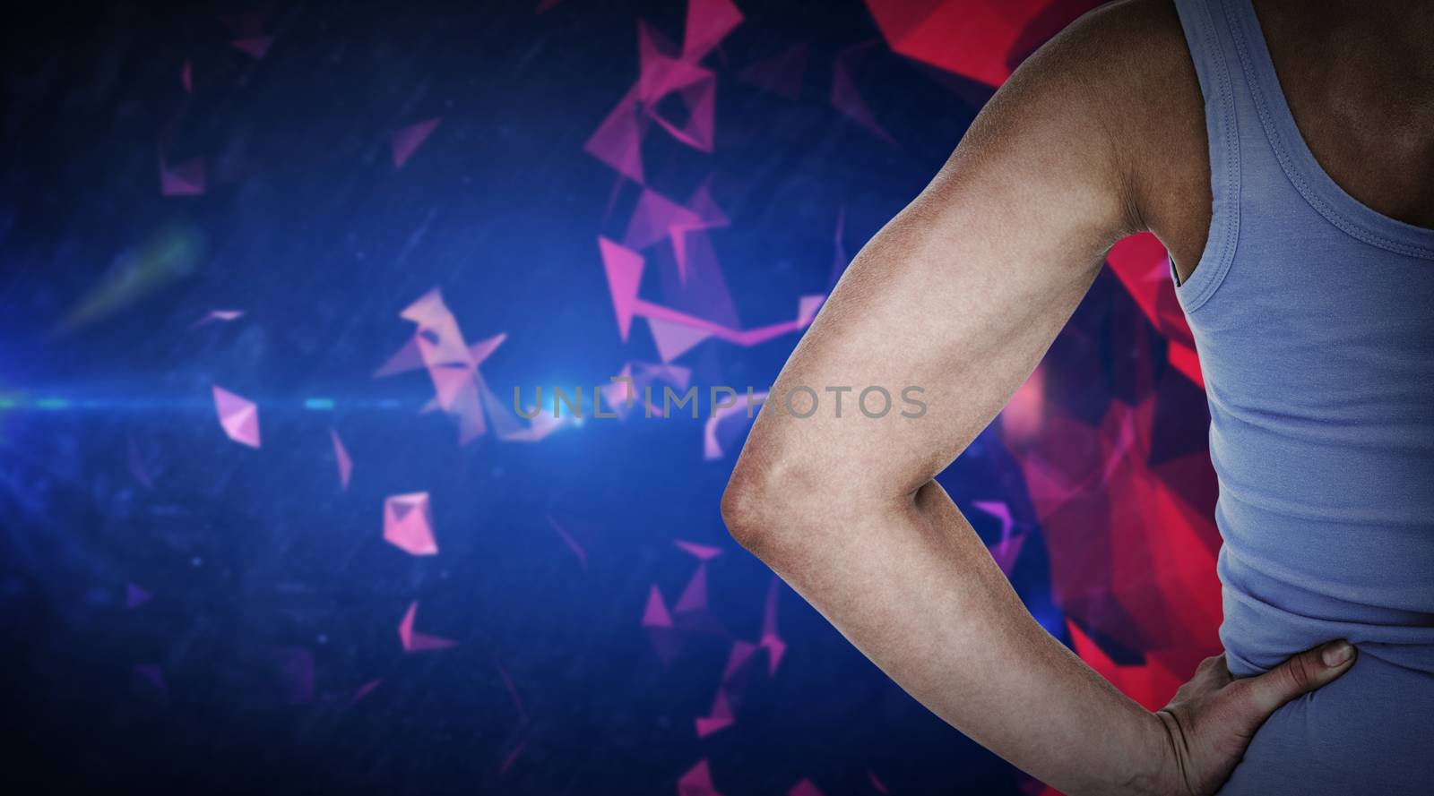 Back view of muscular woman  against dark abstract design