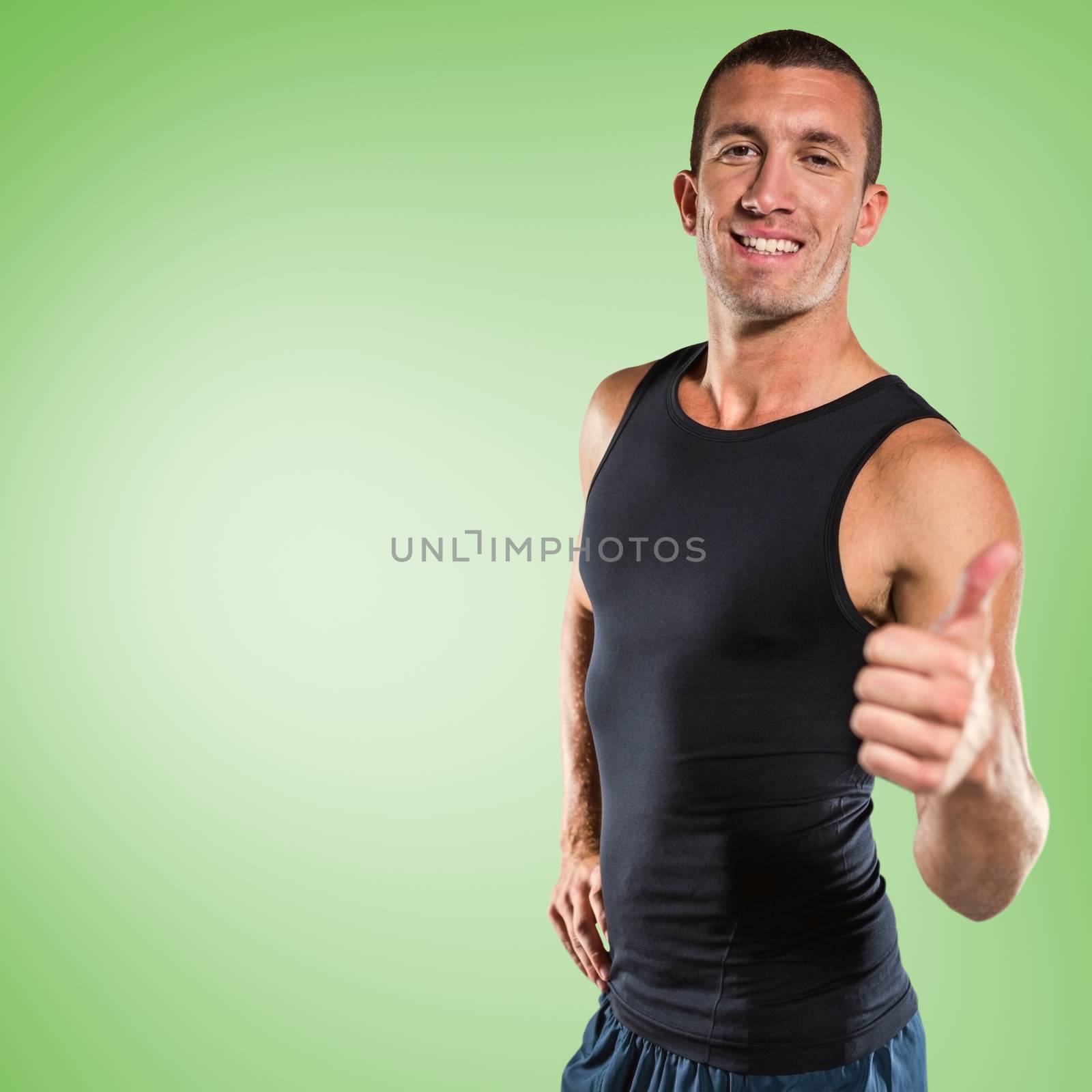 Composite image of happy athlete showing thumbs up by Wavebreakmedia
