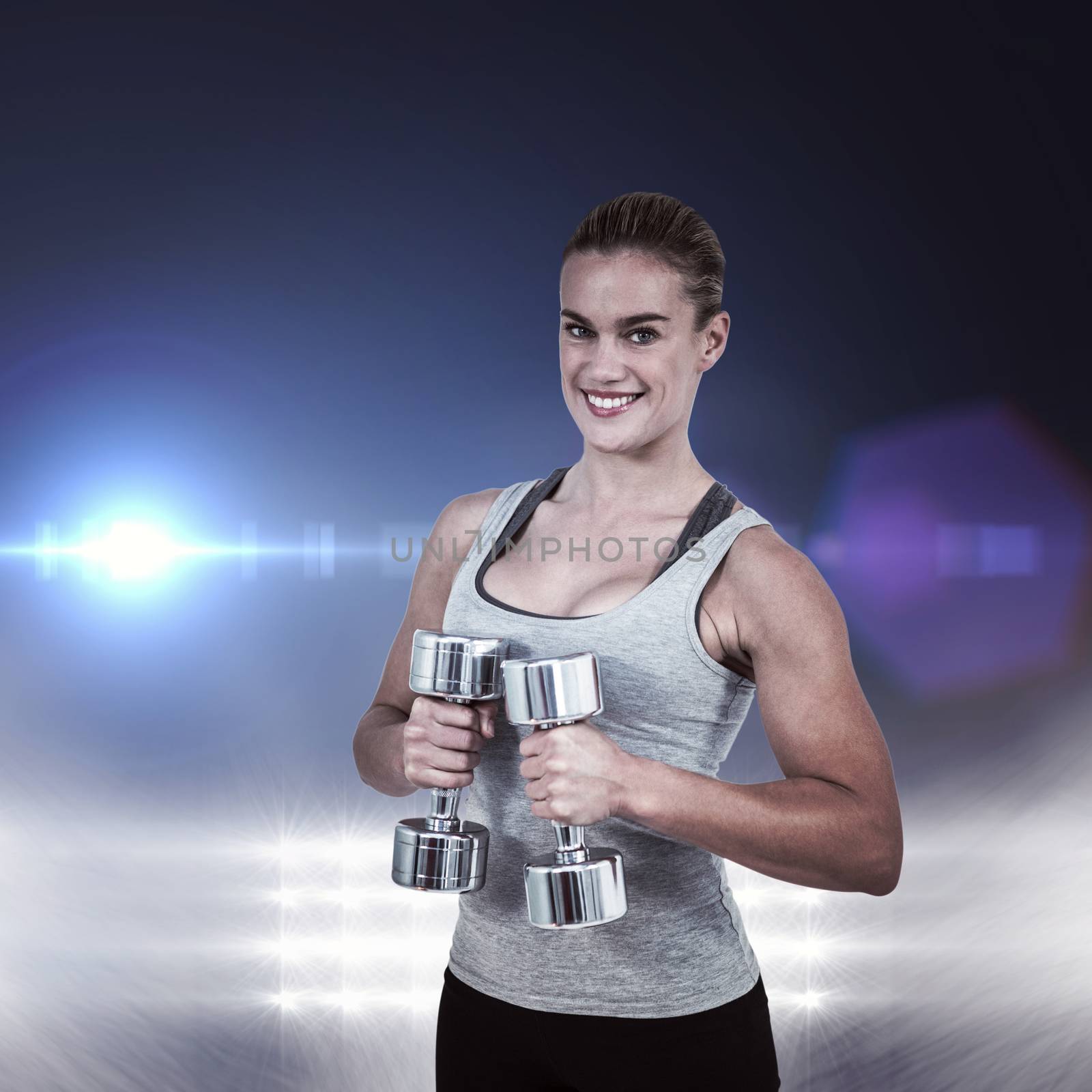  Muscular woman working out with dumbbells  against spotlights Muscular woman working out with dumbbells on white background