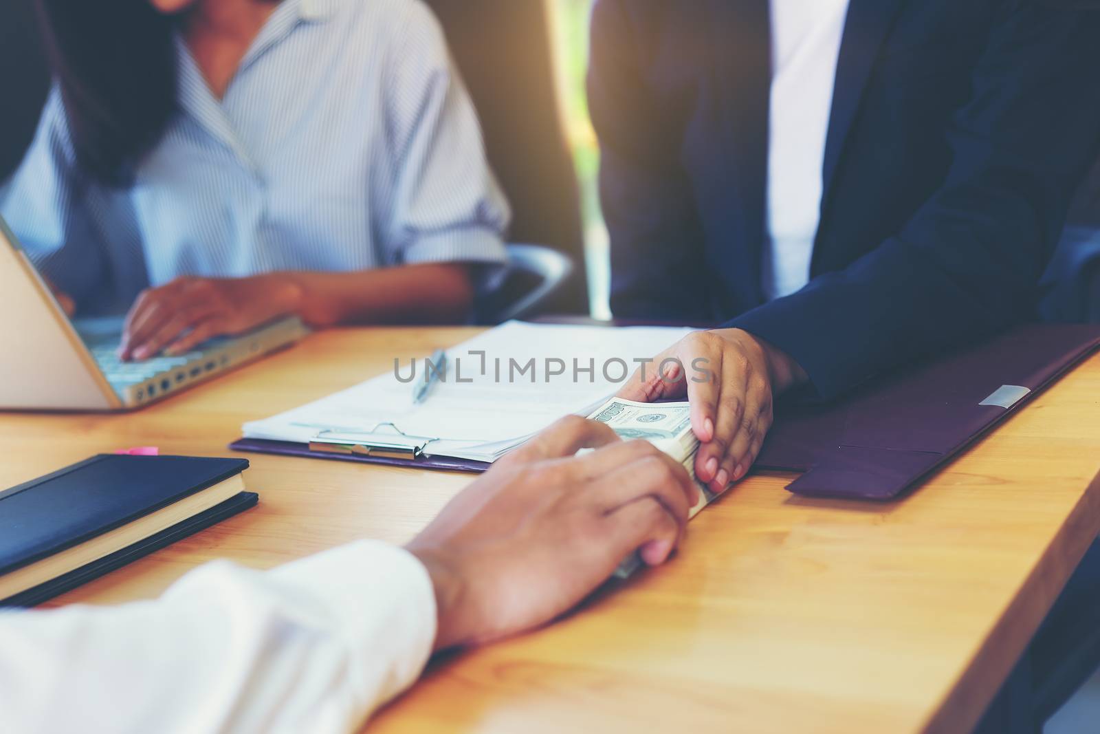 Business woman signing a loan for investment, negotiation