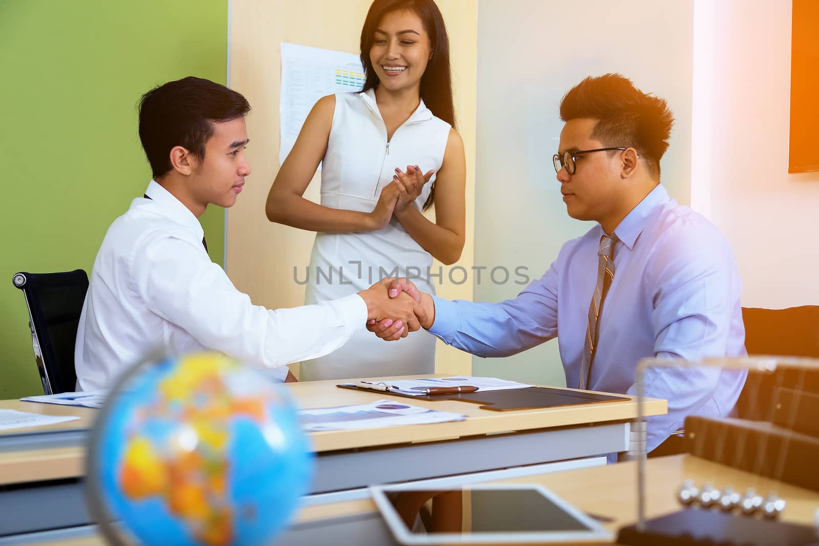 Image of a businessman joining hands after agreeing to a business deal.