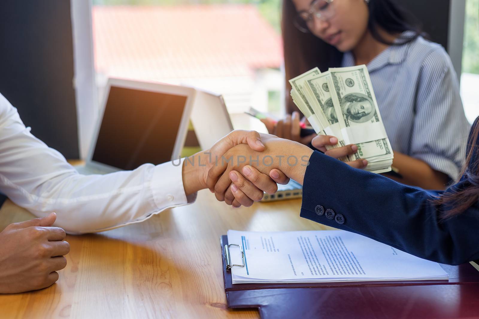 Business woman signing a loan for investment, negotiation