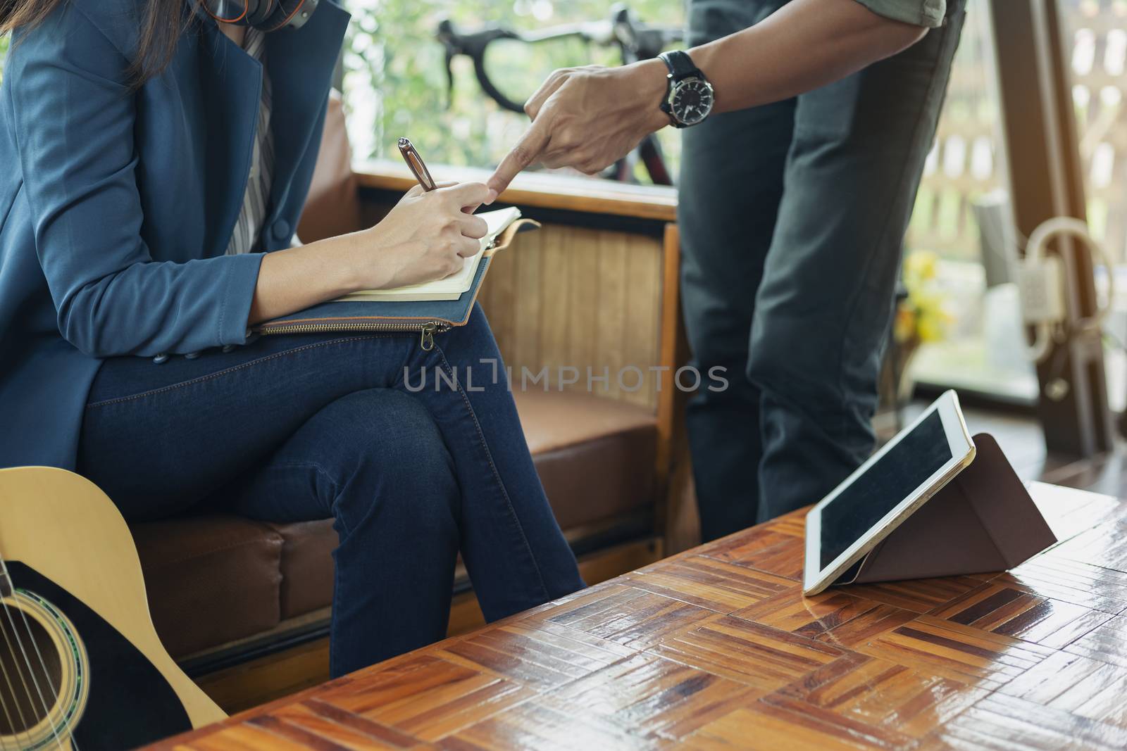 Beautiful girl is playing guitar by the window. Education lifestyle relax concept