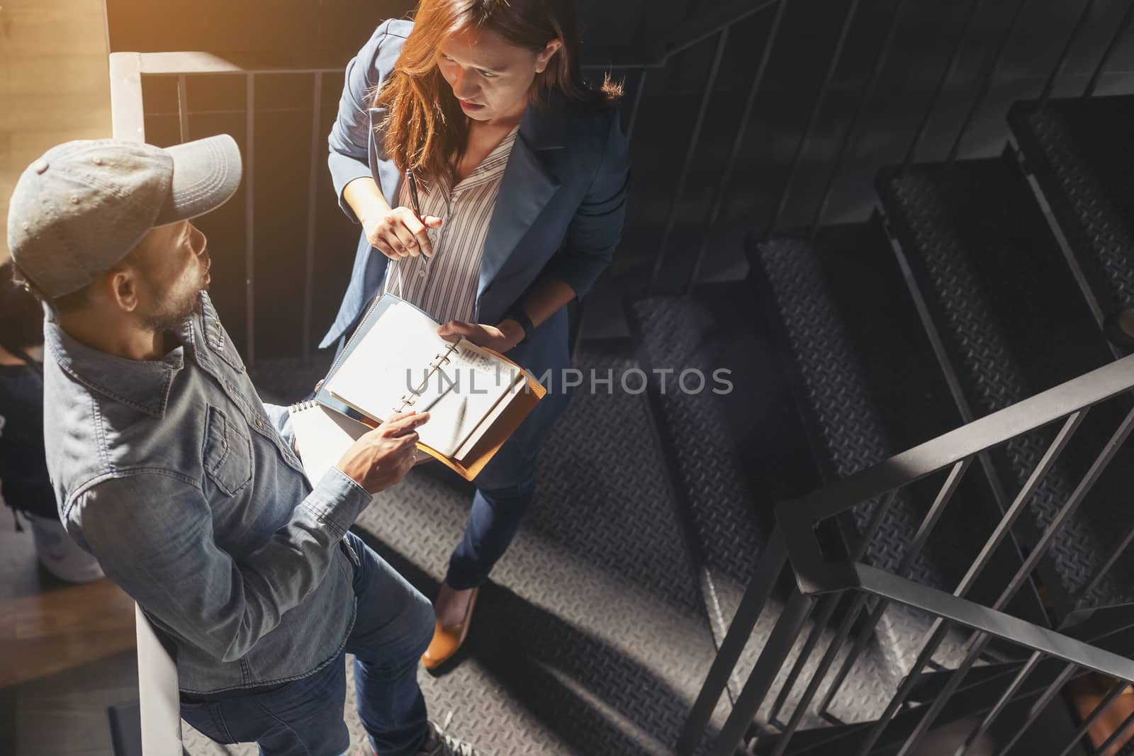 Portrait of focused businesspeople and architect working on project together in modern office. Teamwork concept