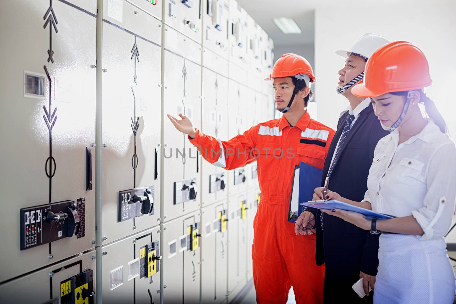 Executives and Electrical Engineers are checking the electrical equipment for their readiness.