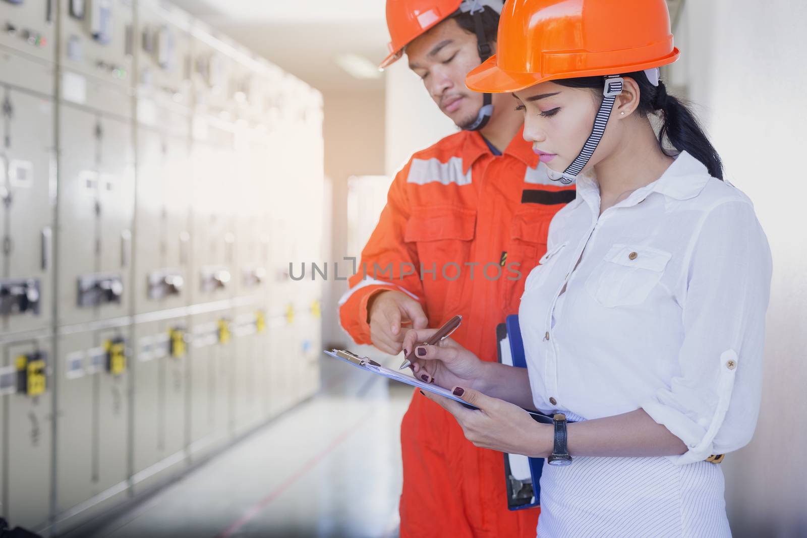 Executives and Electrical Engineers are checking the electrical equipment for their readiness.