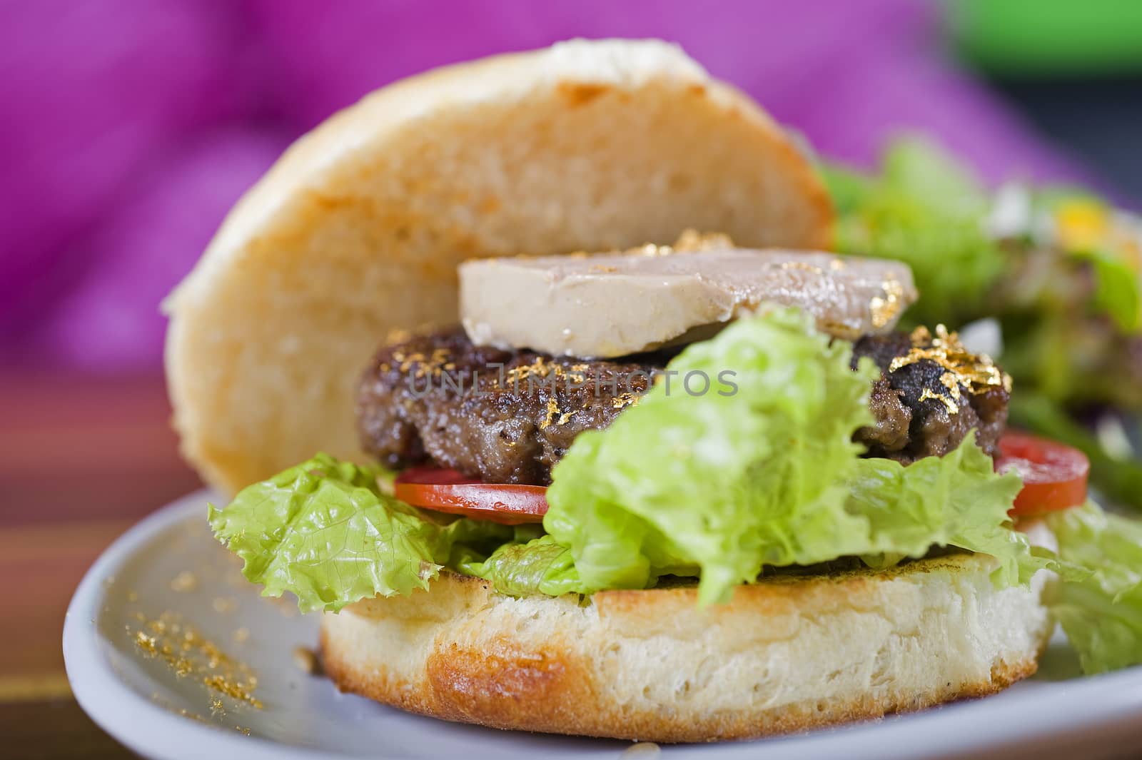 Gourmet beef burger with fois gras and gold leaf