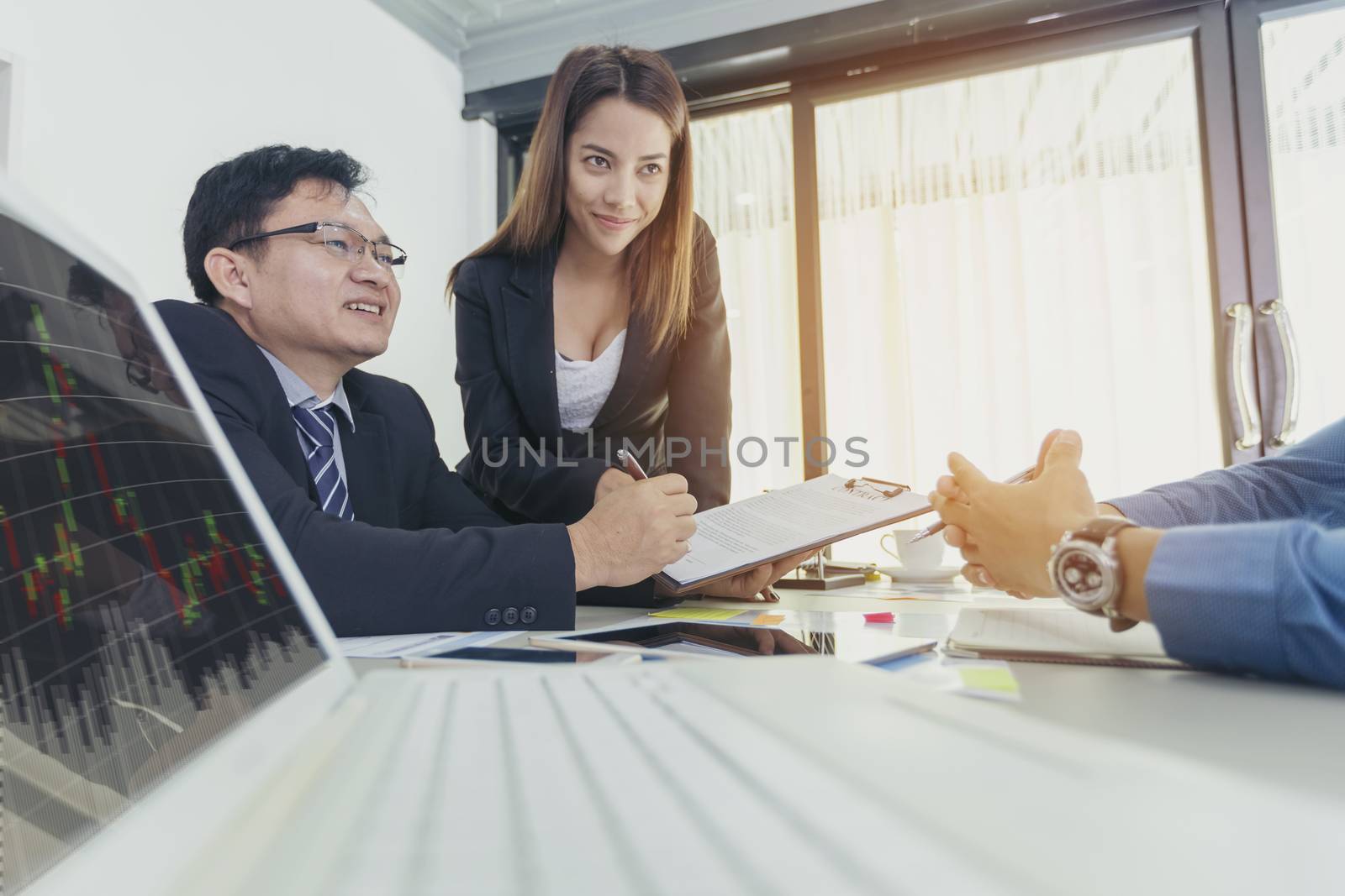 Business - businesspeople have a meeting with presentation in office, they negotiate a contract. Teamwork Concept