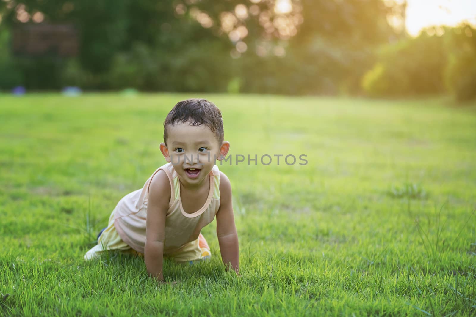 Happy child with dandelions in the countryside at springtime. Concepts of family, healthy lifestyles and happiness.