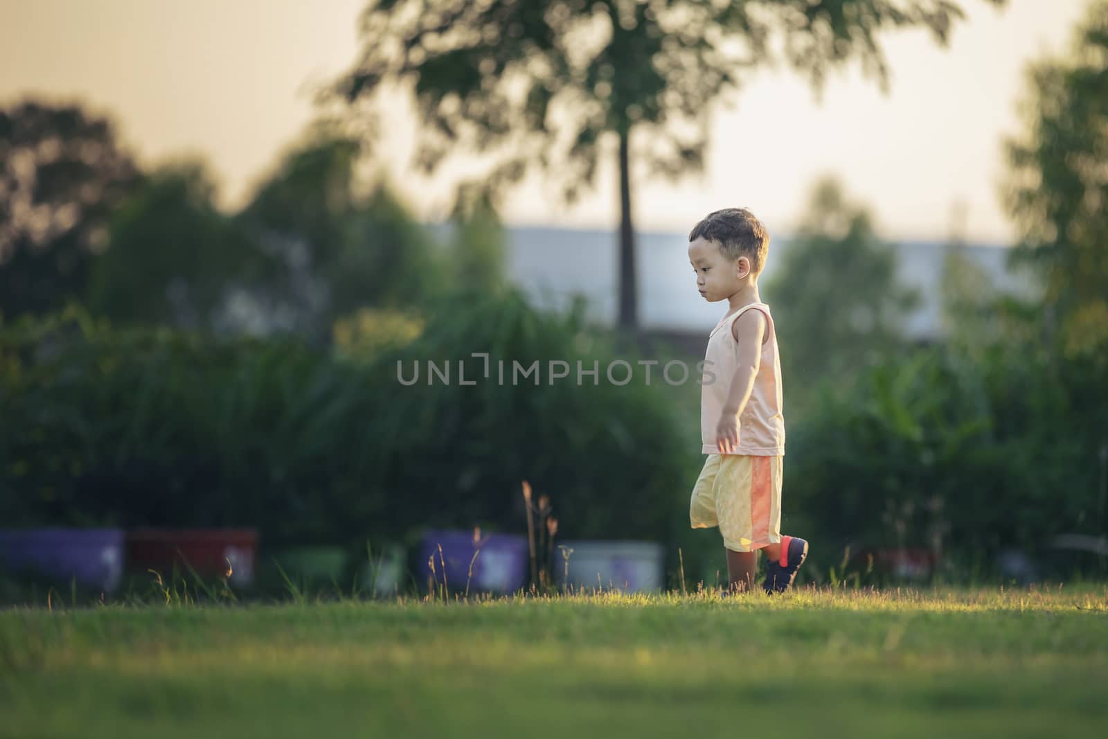 Happy child with dandelions in the countryside at springtime. Co by numberone9018