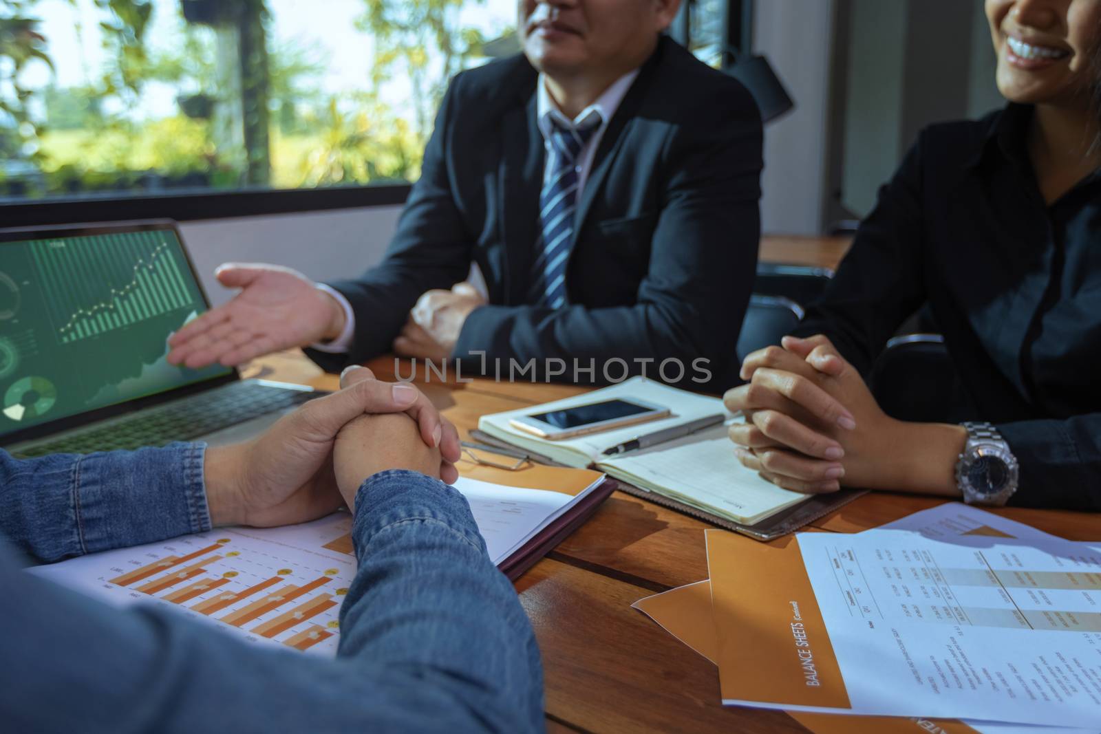 Businesswomen hands working with finance are analyzing the information to make investment decisions, with experienced business consultants. business analysis, and strategic ideas.