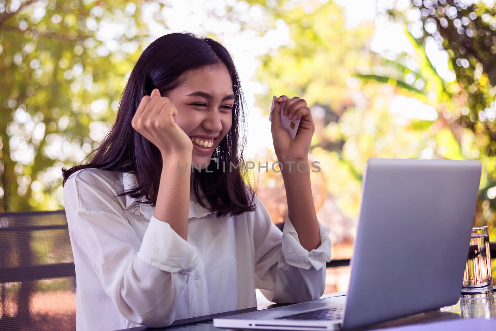 Surprised happy beautiful woman from online shopping.