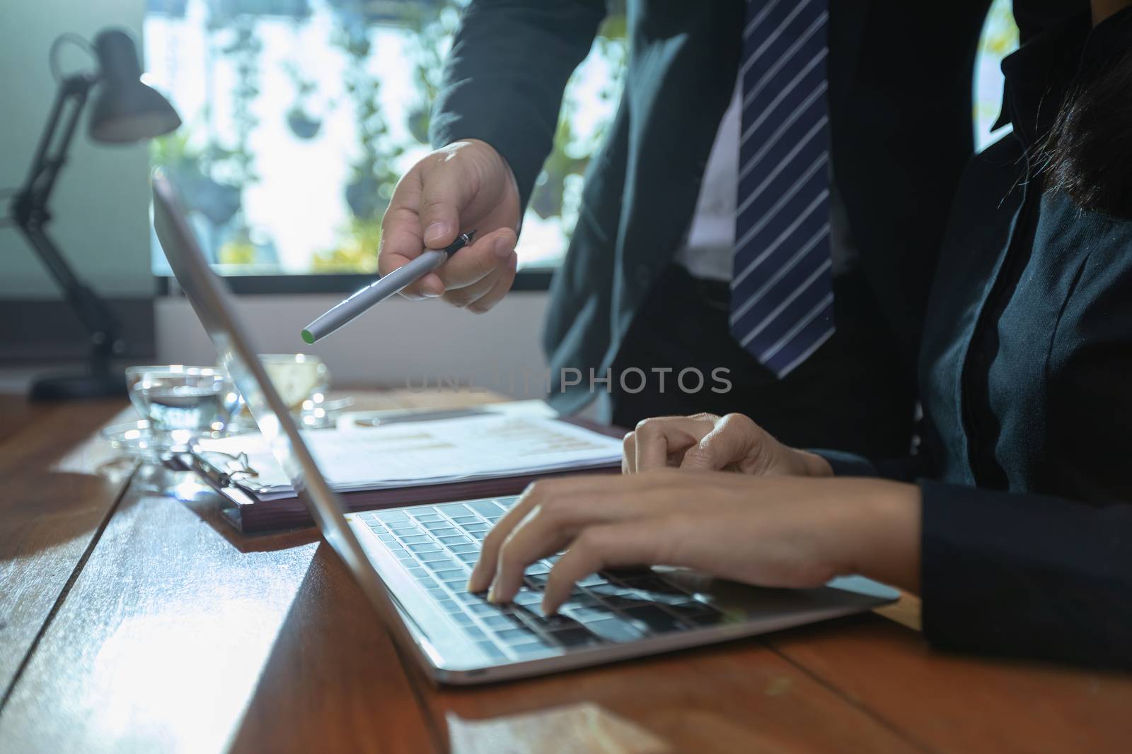 Businesswomen hands working with finance are analyzing the infor by numberone9018