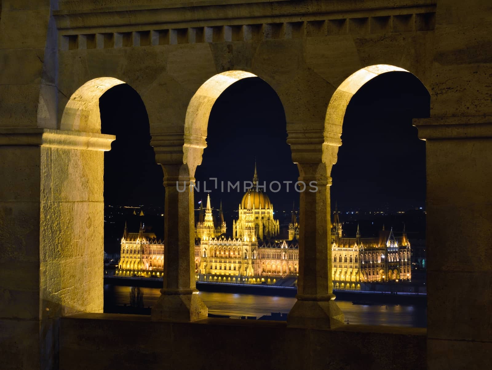 Hungarian Parliament through Fishermans bastion arcades, Budapest.