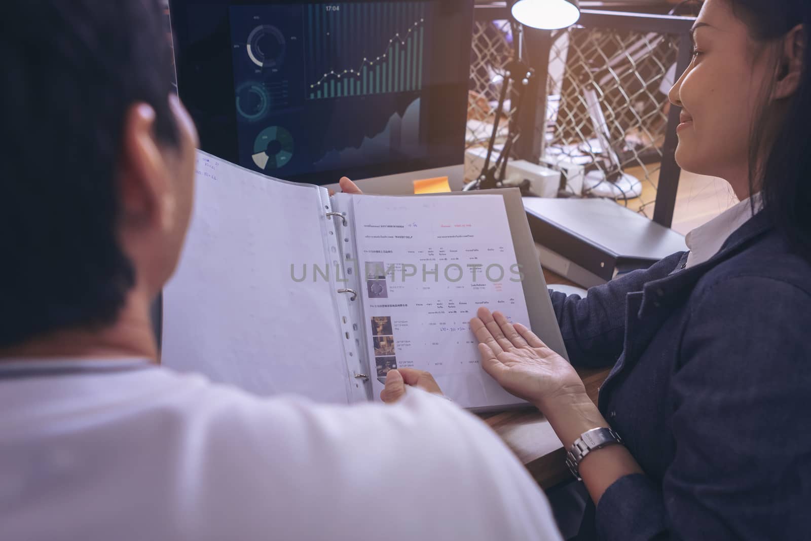 Businessman giving presentation on paper charts to colleagues in office. Business meeting time. Idea presentation, analyze plans.