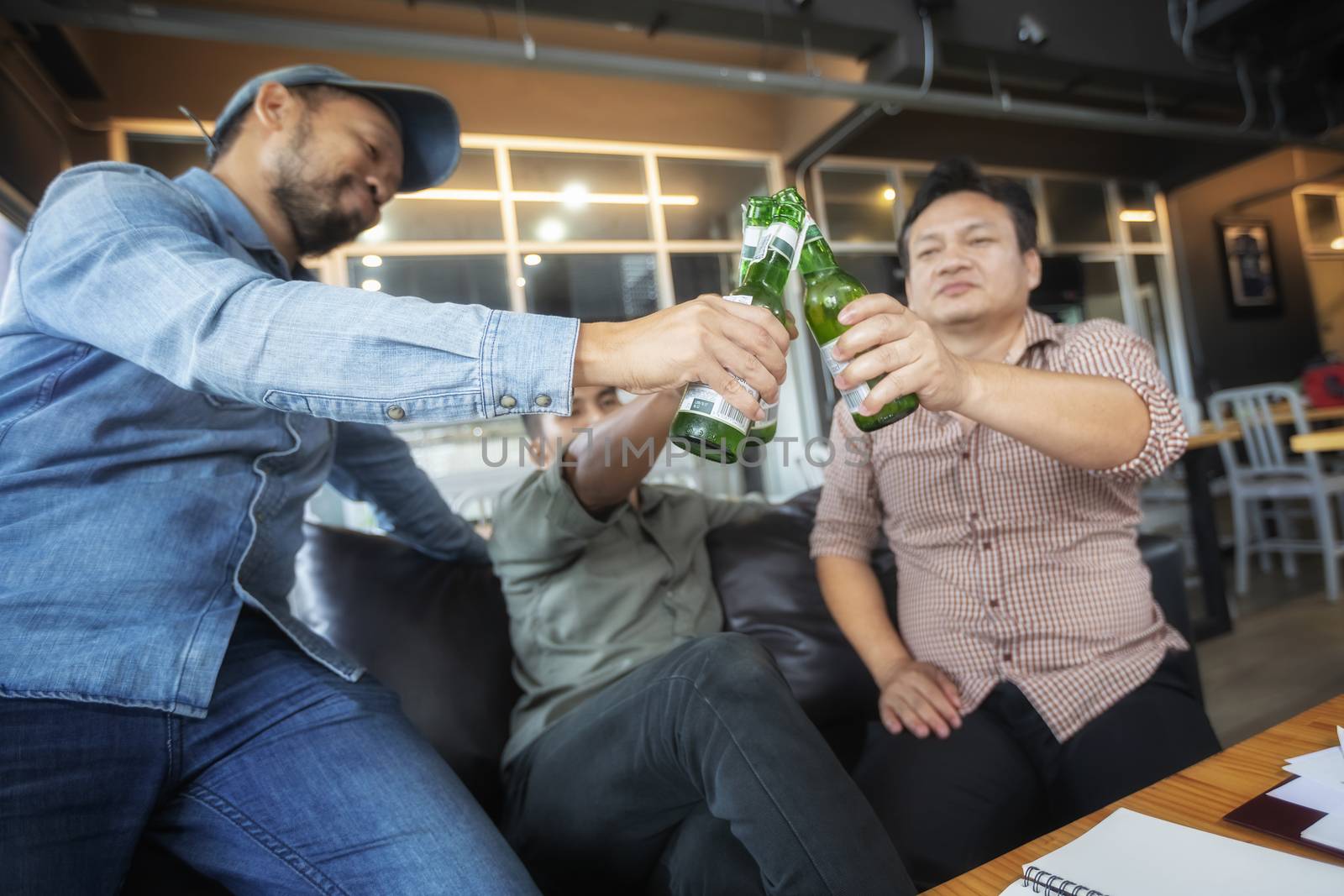 Business people are drinking to celebrate the success of their work.