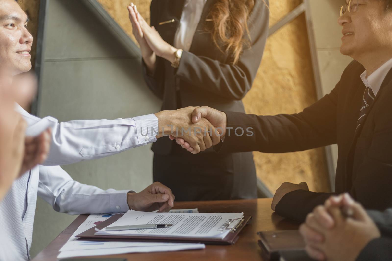 Businessmen shake hands After business negotiation by numberone9018