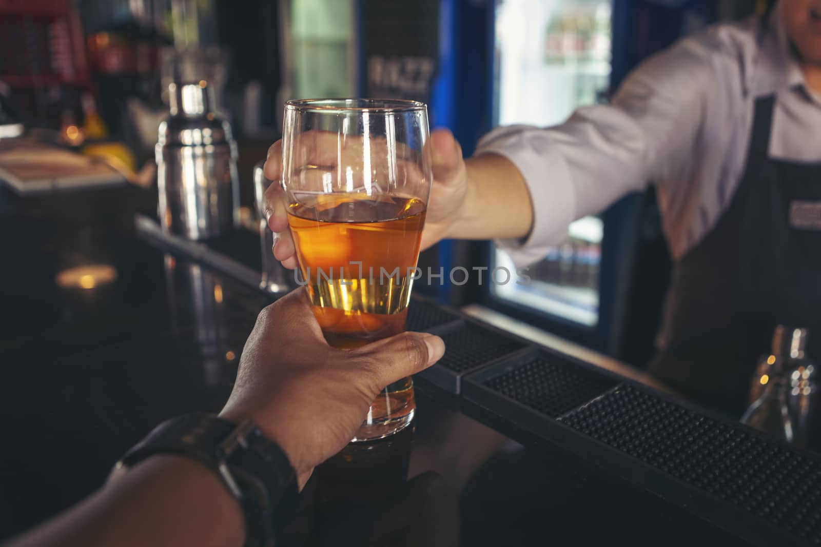 Cheers! Group of people cheering with drinks with alcohol. Celebration after successful 