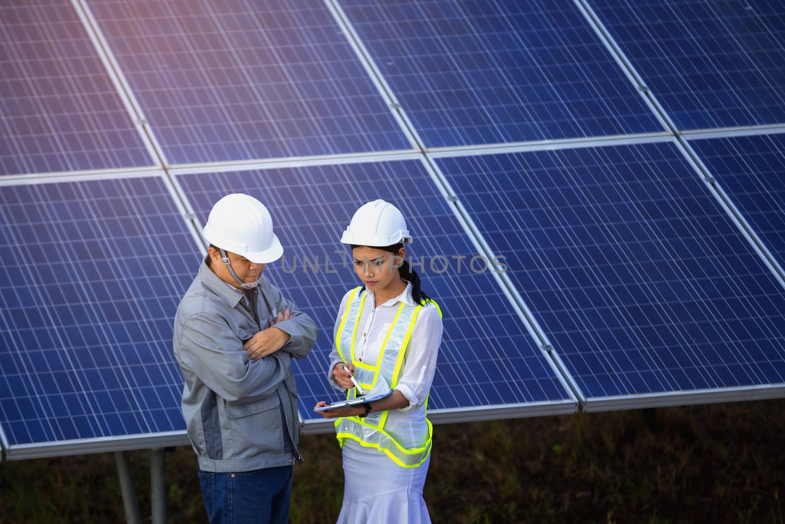 Engineers are checking the solar panel for maintenance. And clean the solar panel is always available.