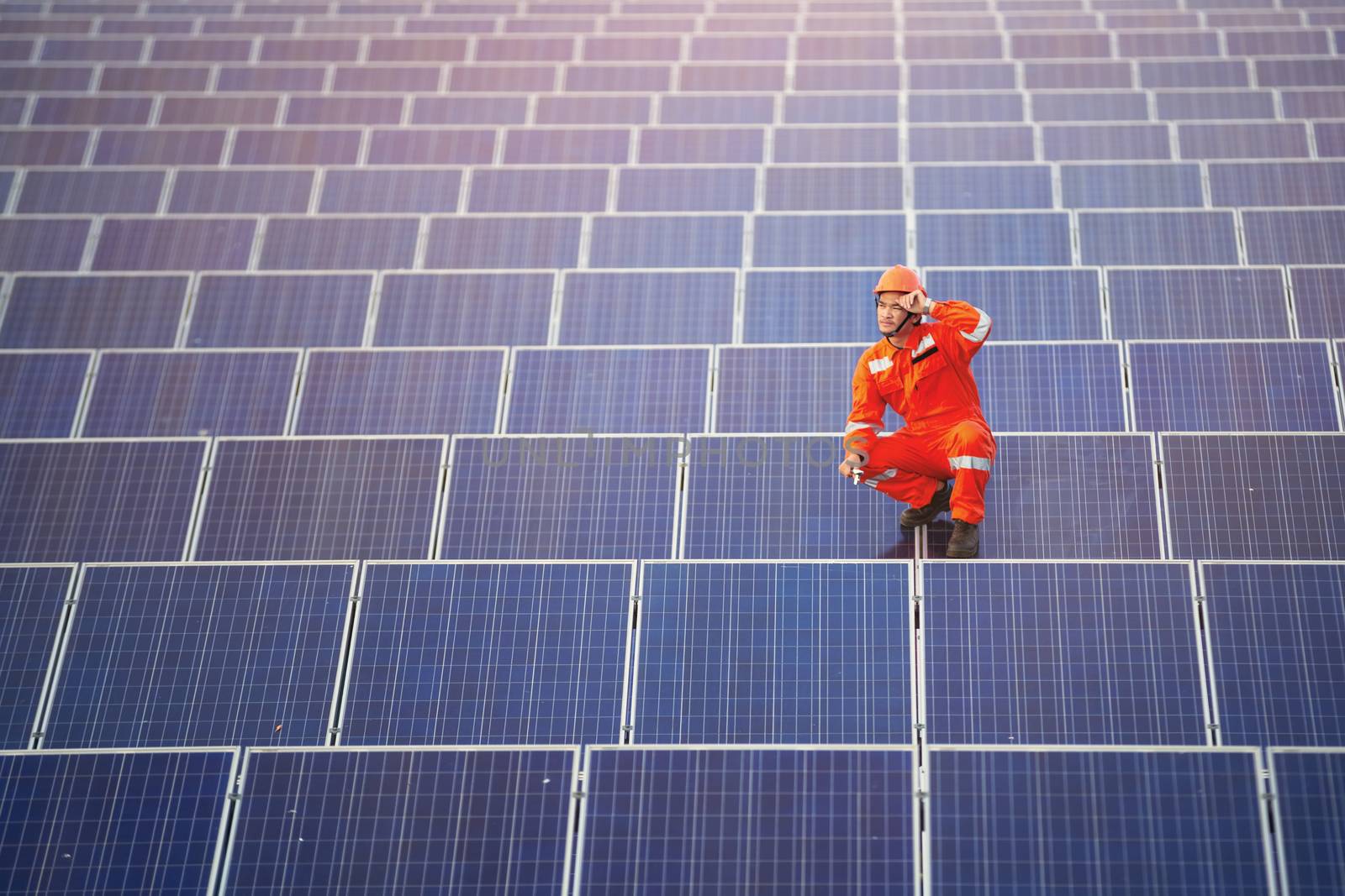 Engineers are checking the solar panel for maintenance. And clean the solar panel is always available.