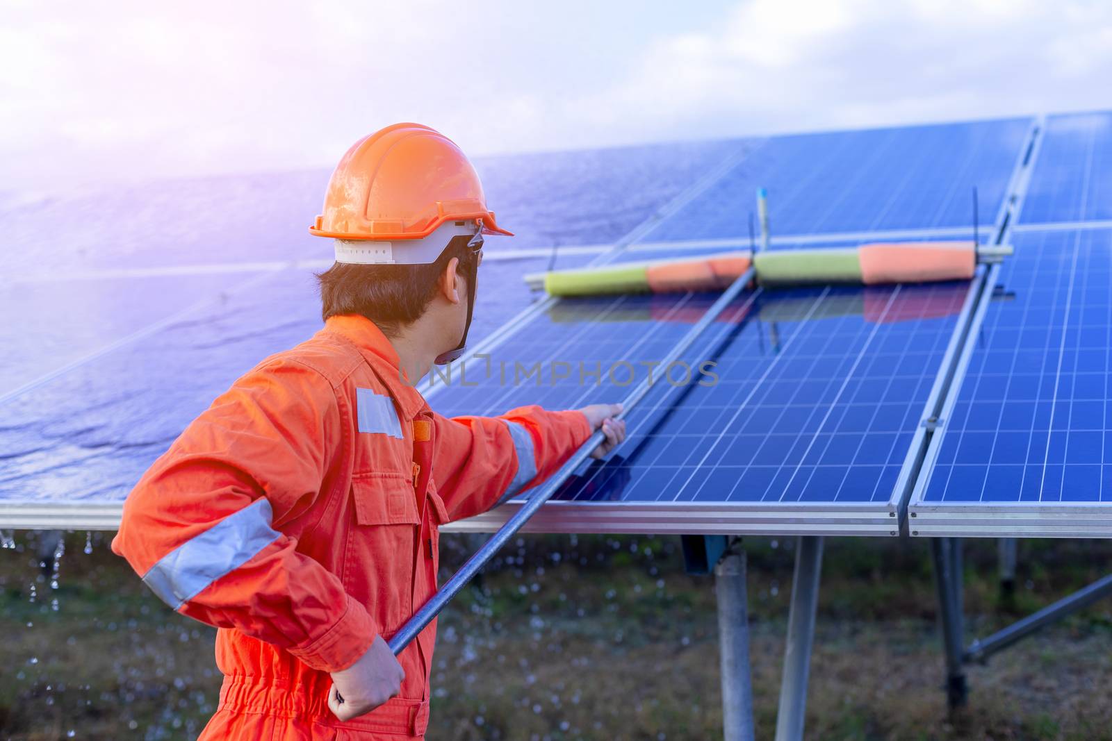 Engineers are checking the solar panel for maintenance. And clean the solar panel is always available.