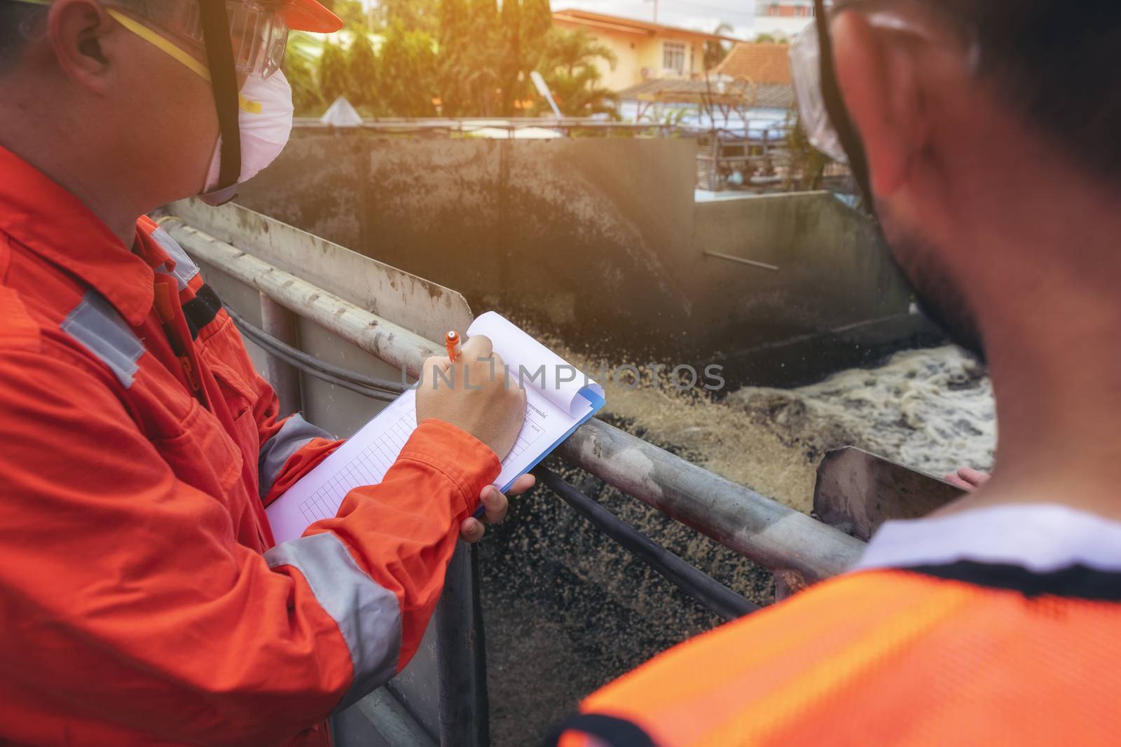 The maintenance technician is inspecting the wastewater treatment equipment of the treatment plant so that it can be operated at all times.