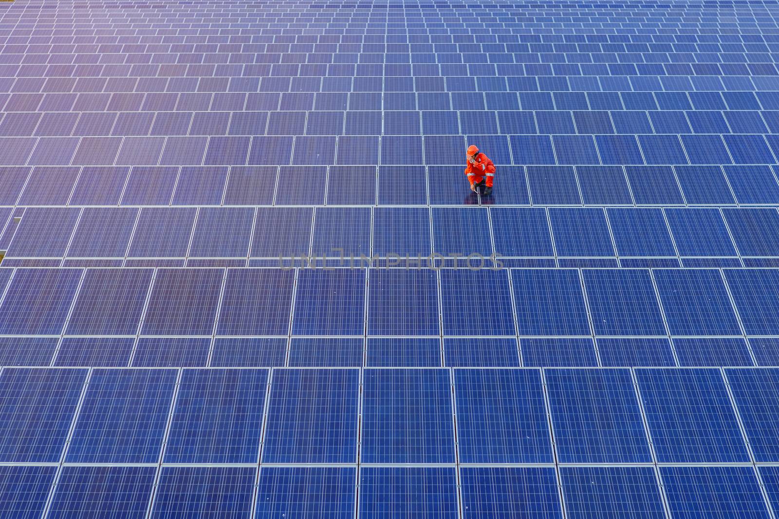 Engineers are checking the solar panel for maintenance. And clean the solar panel is always available.