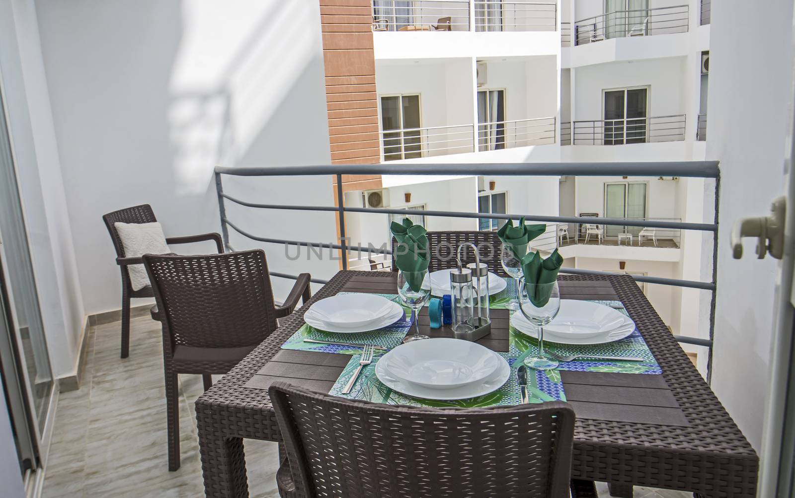 Terrace furniture of a luxury apartment in tropical resort with plastic dining table furniture