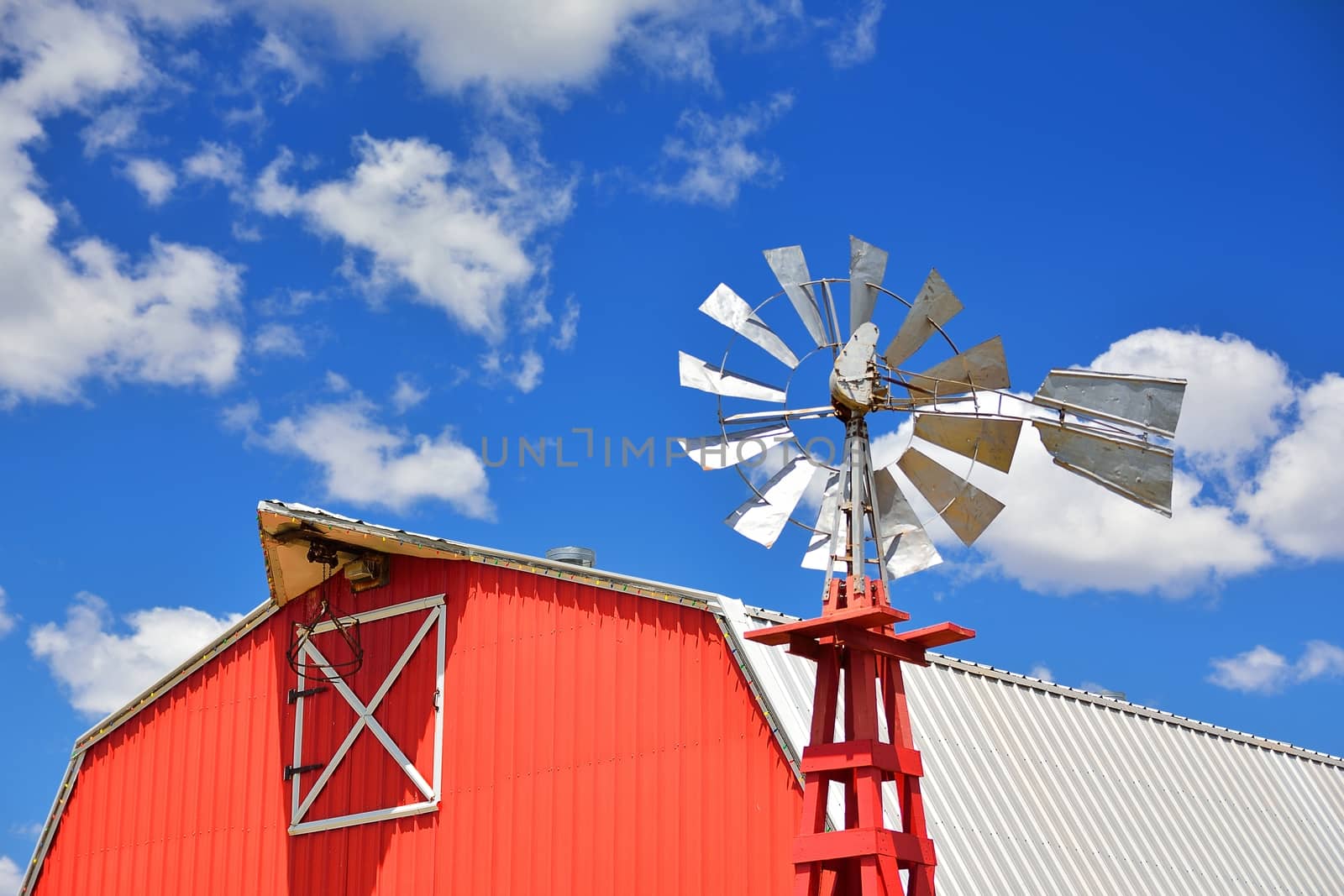 Windmill on an agricultural farm in USA. by CreativePhotoSpain