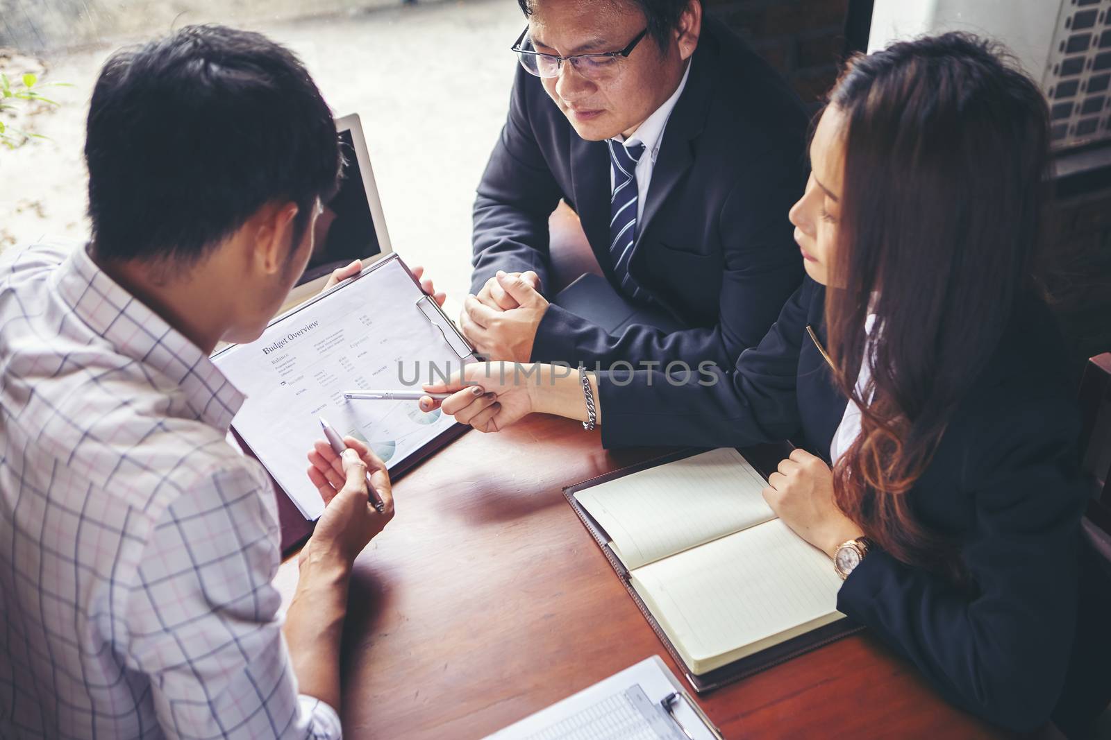 Group of young businessmen are meeting and presenting a plan for successful marketing and business planning.